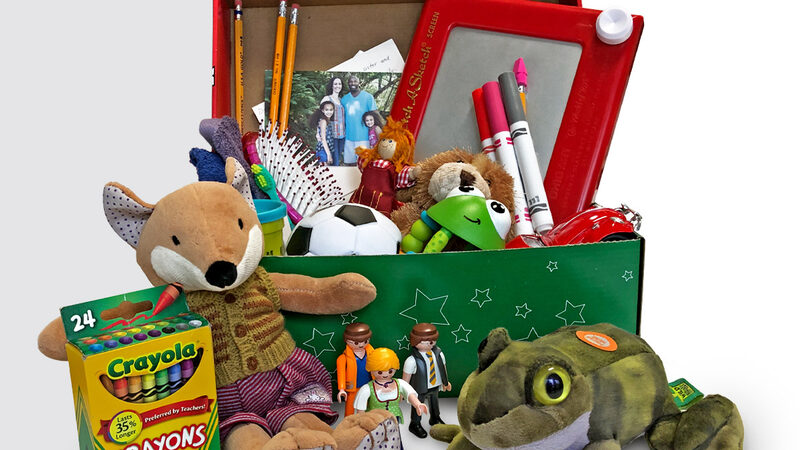 An Operation Christmas Child shoebox packed with toys, school supplies and a soccer ball